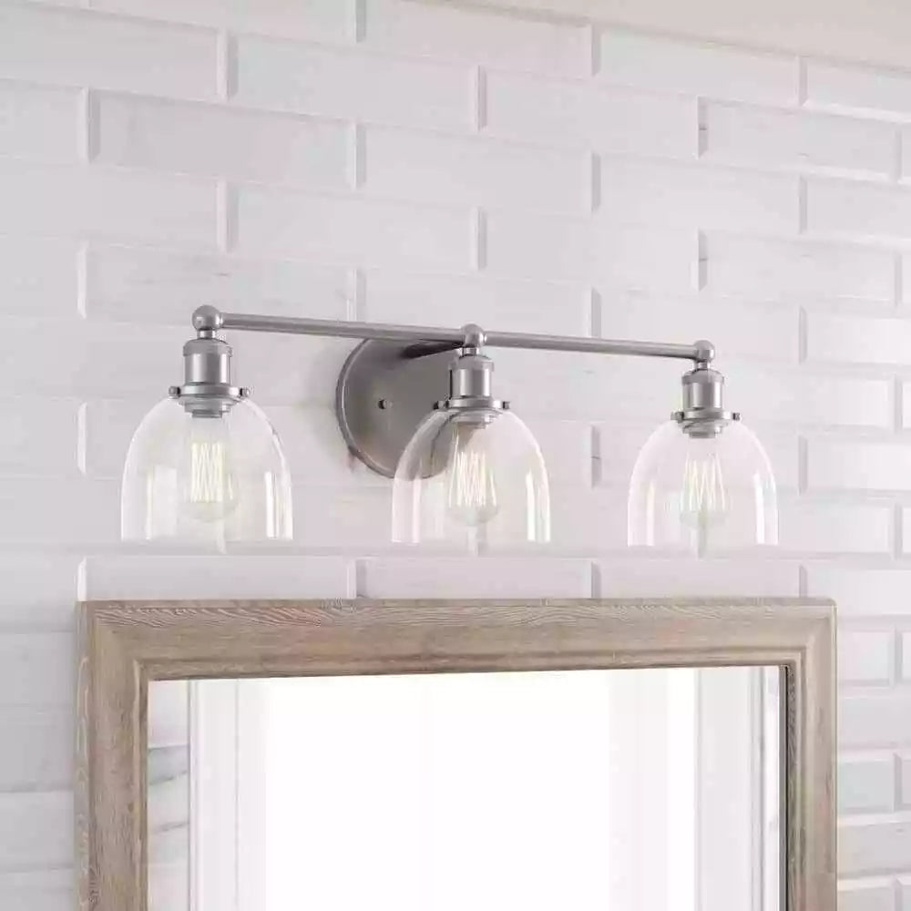 Home Decorators Collection 1004 693 671 | Evelyn 26.75 in. 3-Light Brushed Nickel Vanity Light with Clear Glass Shades