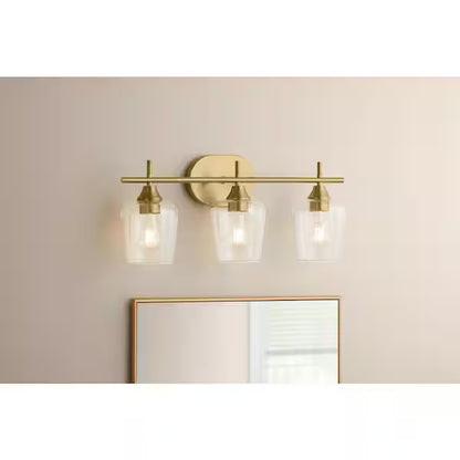 Hampton Bay 1006808031 | Pavlen 24 in. 3-Lights Antique Brass Vanity Light with Clear Glass Shades
