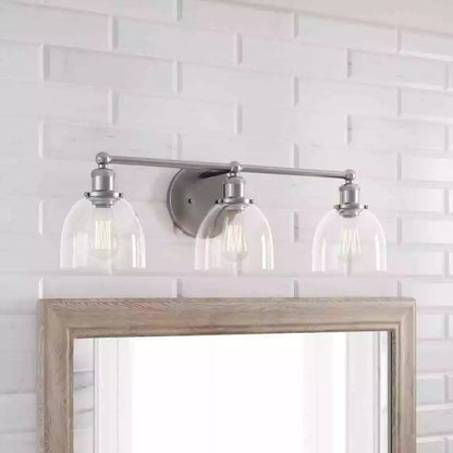 Home Decorators Collection 1004 693 671 | Evelyn 26.75 in. 3-Light Brushed Nickel Vanity Light with Clear Glass Shades